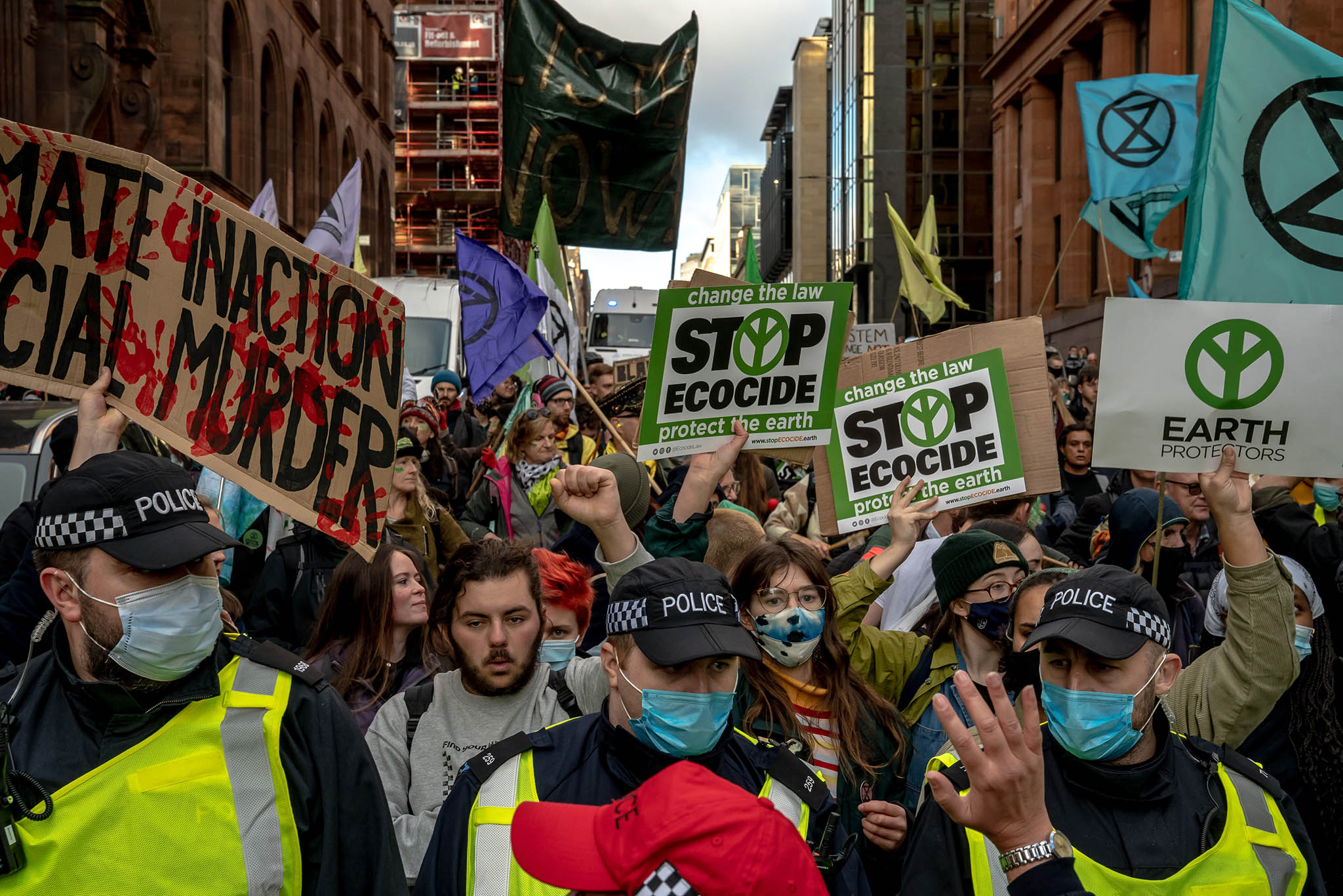 Mostly young activists demand better action against climate change during a 2021 climate summit in Glasgow. Youth are vital to building political will to limit climate disaster — but are excluded from global policymaking. (Andrew Testa/The New York Times)