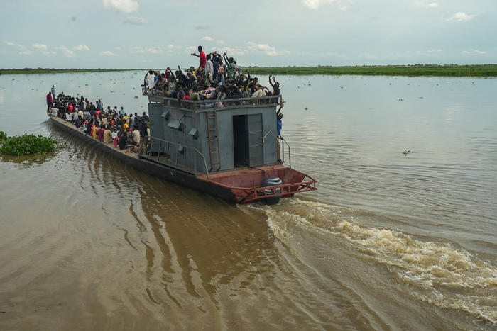 Refugees that fled fighting in Sudan on a barge in Renk, South Sudan, on Aug. 27, 2023. Sudan’s civil war has resulted in 10 million people being forced from their homes and one of the world’s worst hunger crises. (Joao Silva/The New York Times)