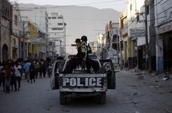 Police patrol Port-au-Prince Saturday, January 16, 2010. (Photo Courtesy: Damon Winter/NY Times).