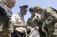 HaitiMarinesPolice.jpg U.S. Marines consult with a police officer in Haiti (Credit: DoD Photo/U.S. AirForce/Tech. Sgt. Andy Dunaway)