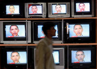 iran_obama_250px_tn.jpg News coverage of President Barack Obama's message to the people of Iran plays on televisions displayed in a store in Manam, Bahrain, on Friday, March 20, 2009. Invoking art, history and "the common humanity that binds us," Obama offered a "new day" in Ame