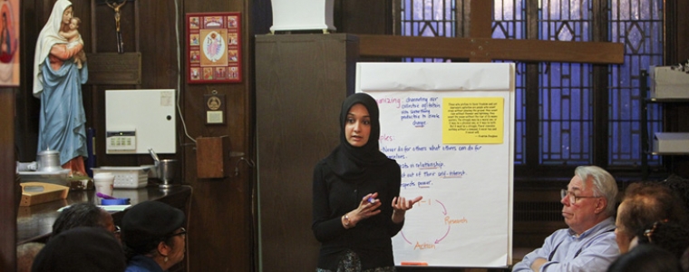 Faiza Ali, a Muslim trained by a Jewish agency to work with a coalition of mostly Christian churches, speaks during a meeting at Our Lady of Refuge Catholic Church in New York, May 1, 2012. Ali is a community organizer trying to increase the impact of the religious left in policy debates.