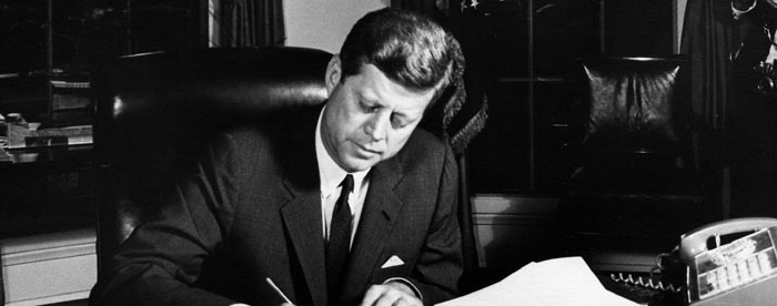 President Kennedy signs the Proclamation for Interdiction of the Delivery of Offensive Weapons to Cuba at the Oval Office on October 23, 1962