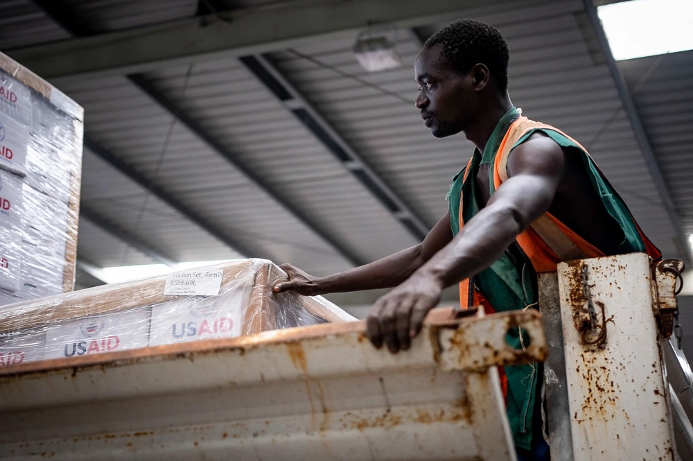 USAID Kitchen are unloaded form a tractor trailer at a warehouse in Beira, Mozambique, April 2019. A new U.S. plan to address conflict prioritizes Mozambique with a long-term, coordinated strategy among U.S. diplomacy, development and security agencies. (U.S. Air Force/Tech. Sgt. Chris Hibben)
