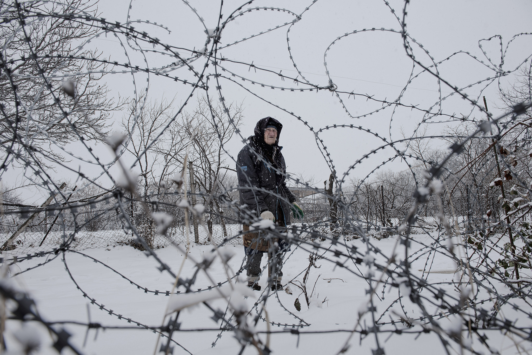 Valya Vanishvili, 85, whose home has been separated from the rest of the village by a Russian fence, in Khurvaleti, Georgia, on March 13, 2022. Russia invaded Georgia in 2008. (Laetitia Vancon/The New York Times)