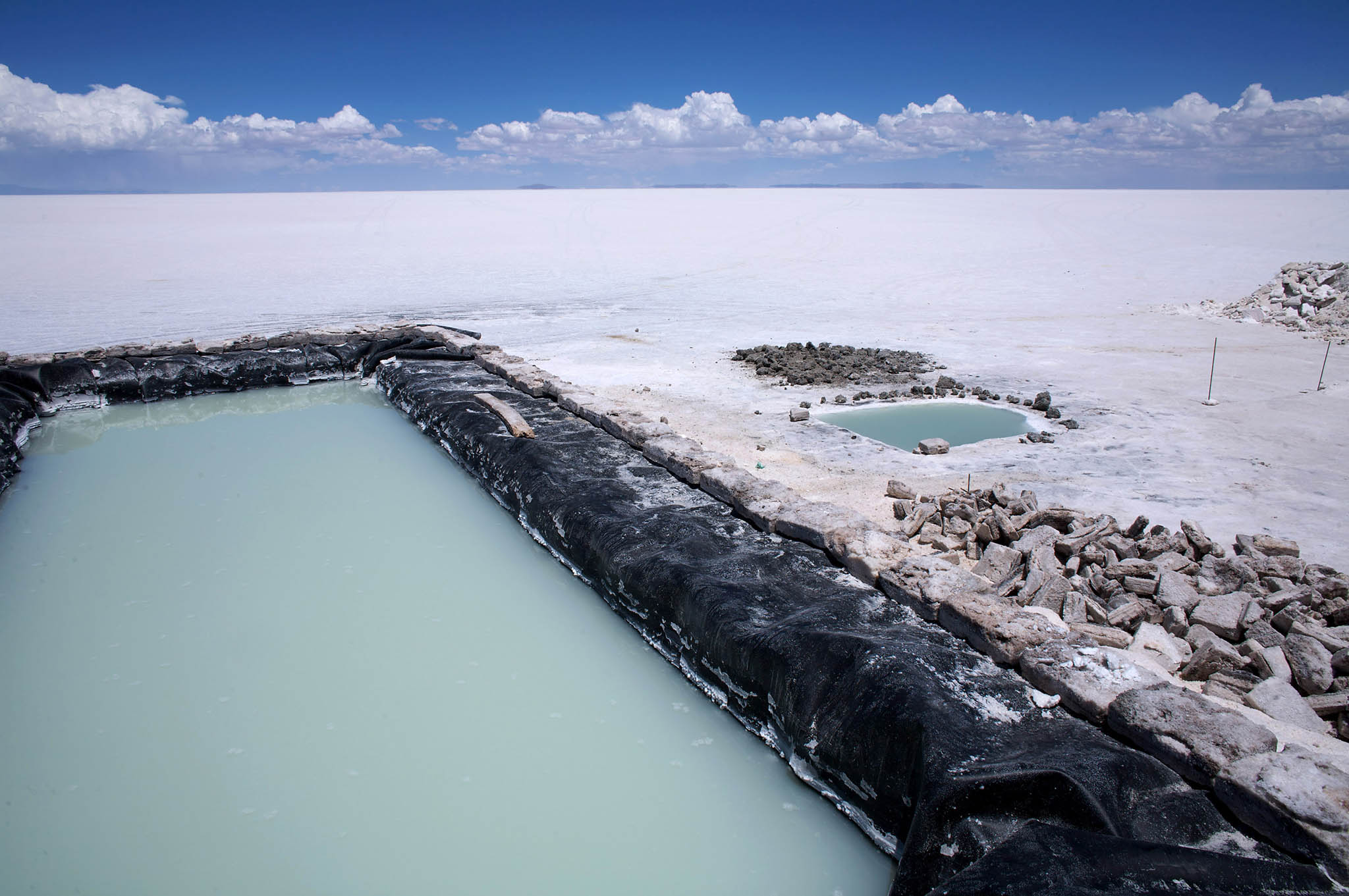 Pools of water are testing grounds for extracting lithium at the Salar de Uyuni (the Uyuni Salt Flats) in Bolivia. Current extraction methods require substantial amounts of water. February 2, 2009. (Noah Friedman-Rudovsky/The New York Times)