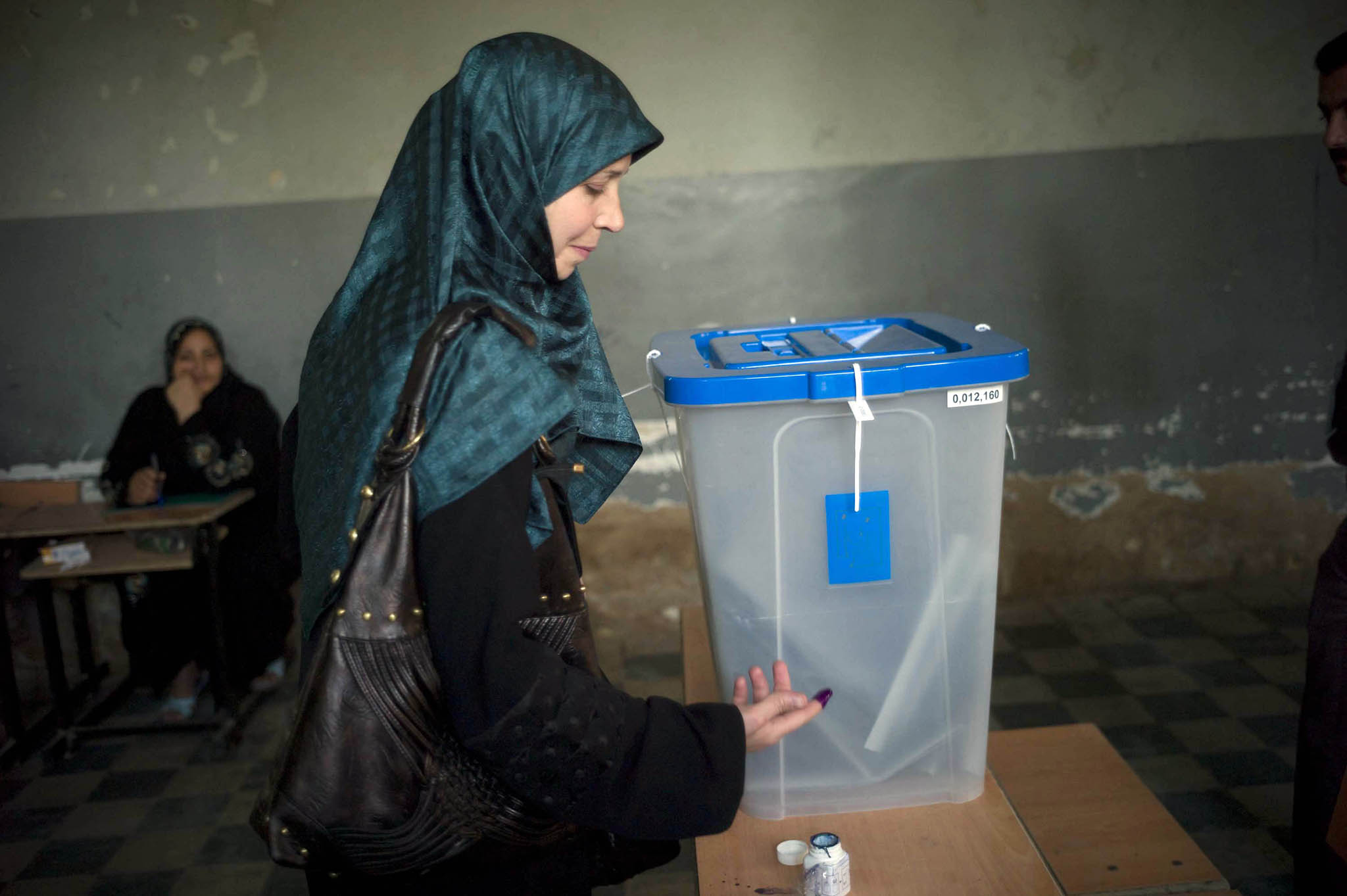 A woman cast her vote in the Karrada neighborhood of Baghdad on March 7, 2010. Iraqis will vote in provincial council elections on December 18. (Michael Kamber/The New York Times)