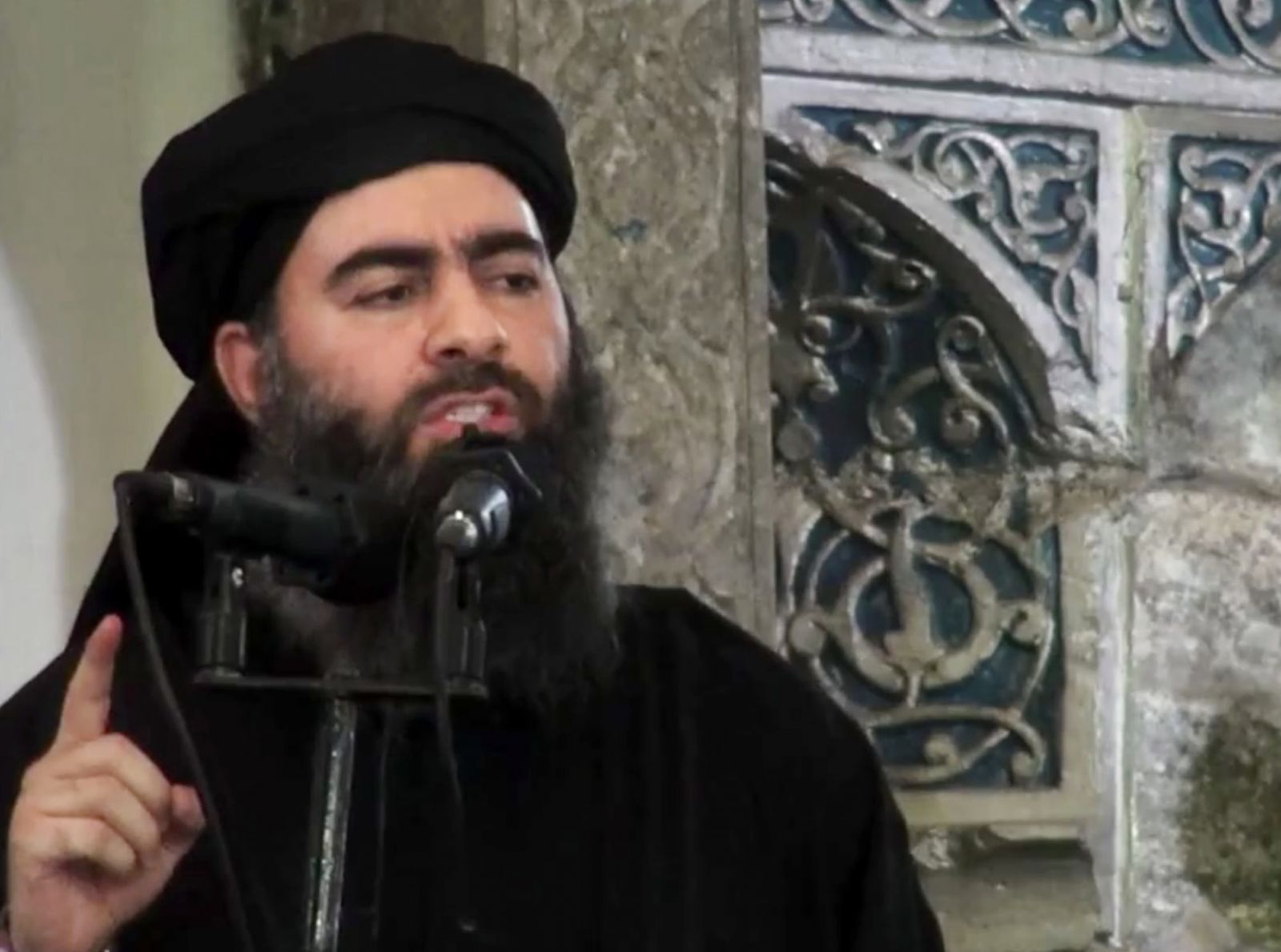 ISIS leader Abu Bakr al- Baghdadi. Image from video posted on a militant website, AP Images. © 2016 Associated Press; used with permission.