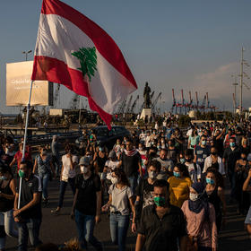 People march in Beirut to honor those killed when a deadly explosion ripped through the heart of the city. Aug. 11, 2020. (Diego Ibarra Sanchez/The New York Times)