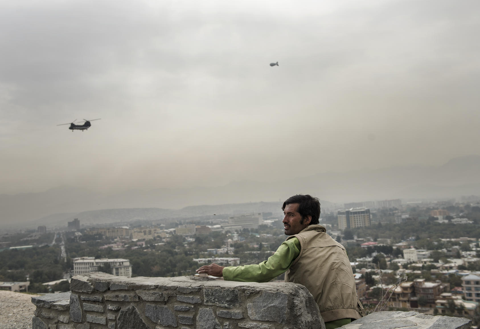 Afghan man watching helicopter