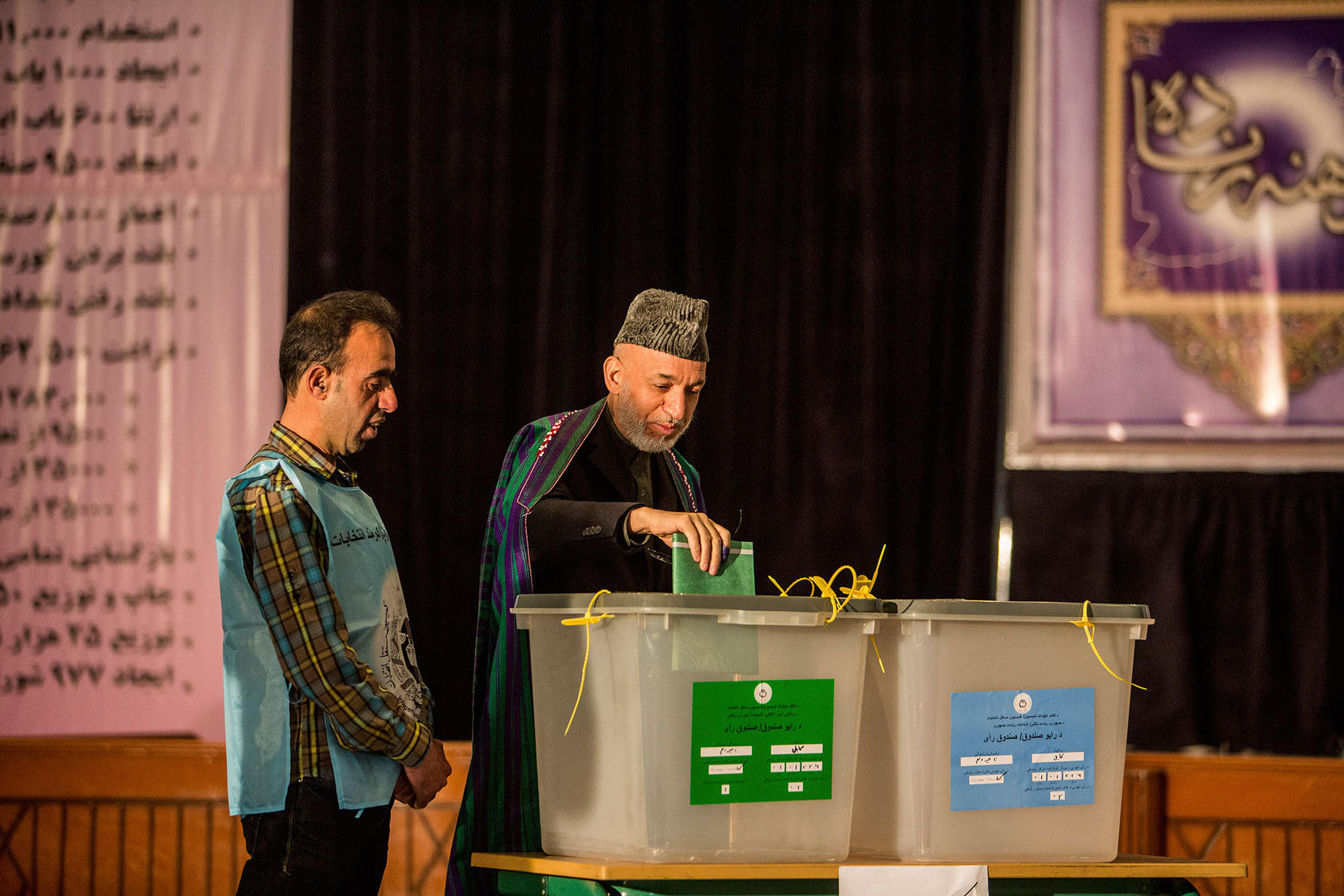 Hamid Karzai, the president of Afghanistan, votes in the election to choose his successor, at a high school in Kabul.