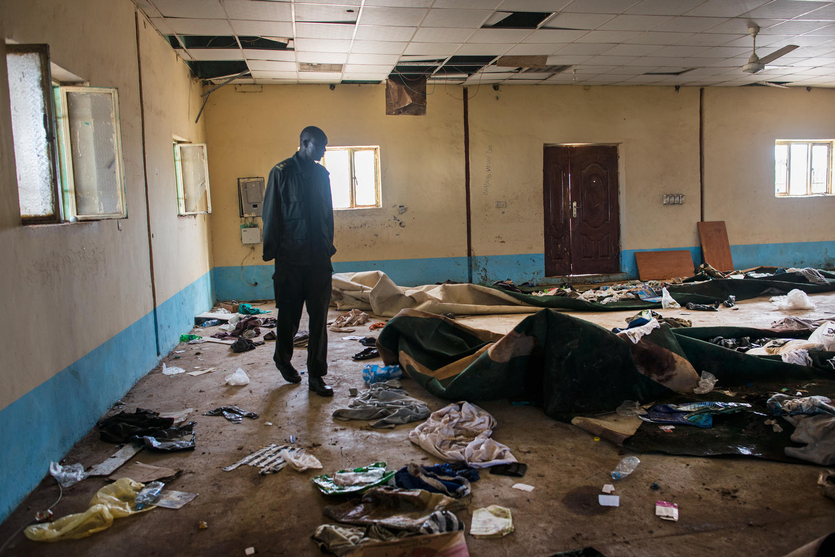 An opposition soldier walks through the remnants of a mosque in Bentiu, South South Sudan, where hundreds of people were killed while taking refuge from the fighting, May 3, 2014. Photo Courtesy of The New York Times/Lynsey Addario
