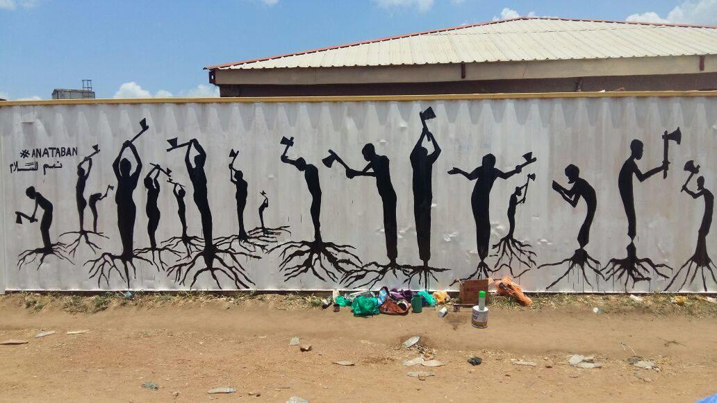 Artists from the peace group Ana Taban painted a wall mural in the capital, Juba, called “Cutting Our Roots,” to suggest the self-destructive nature of the country’s communal civil war. (Ana Taban photo)