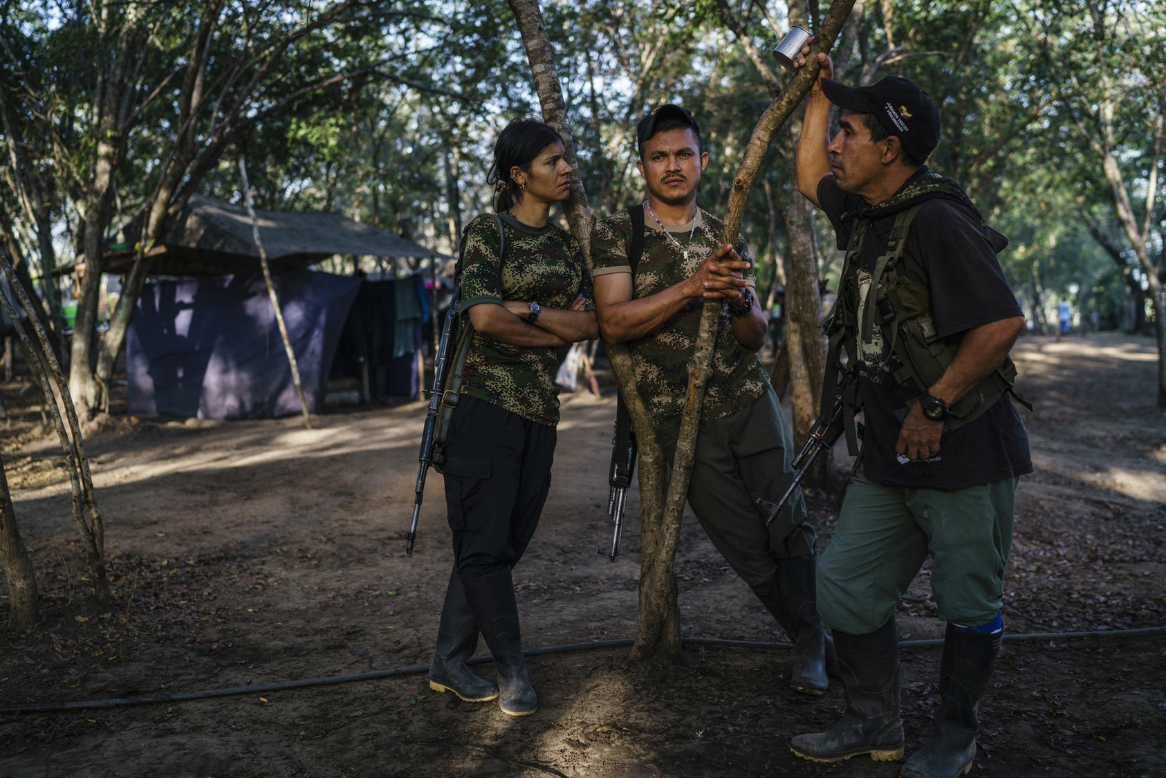 FARC members discuss their future in one of the zones set up to transition the former rebels back to civilian life, near La Paz, Colombia, Feb. 1, 2017. Photo Courtesy of The New York Times/Federico Rios Escobar