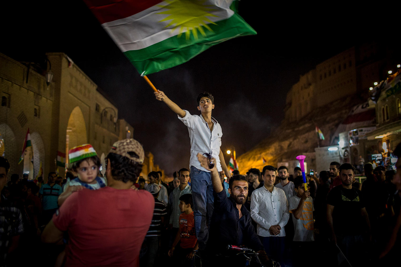 A man waves the Kurdish flag after the results of an independence referendum were announced in Irbil, Iraq, Sept. 27, 2017