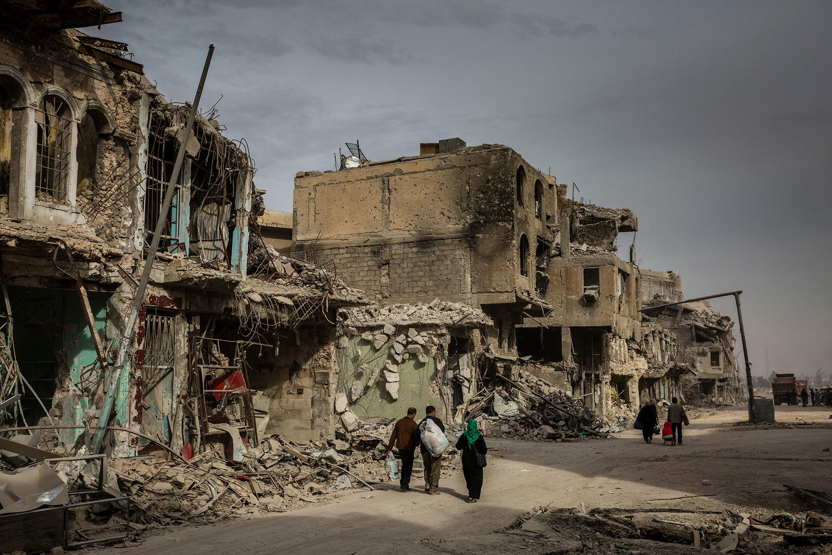 Iraqis return to their destroyed homes in the Old City of Mosul, in December 2017.