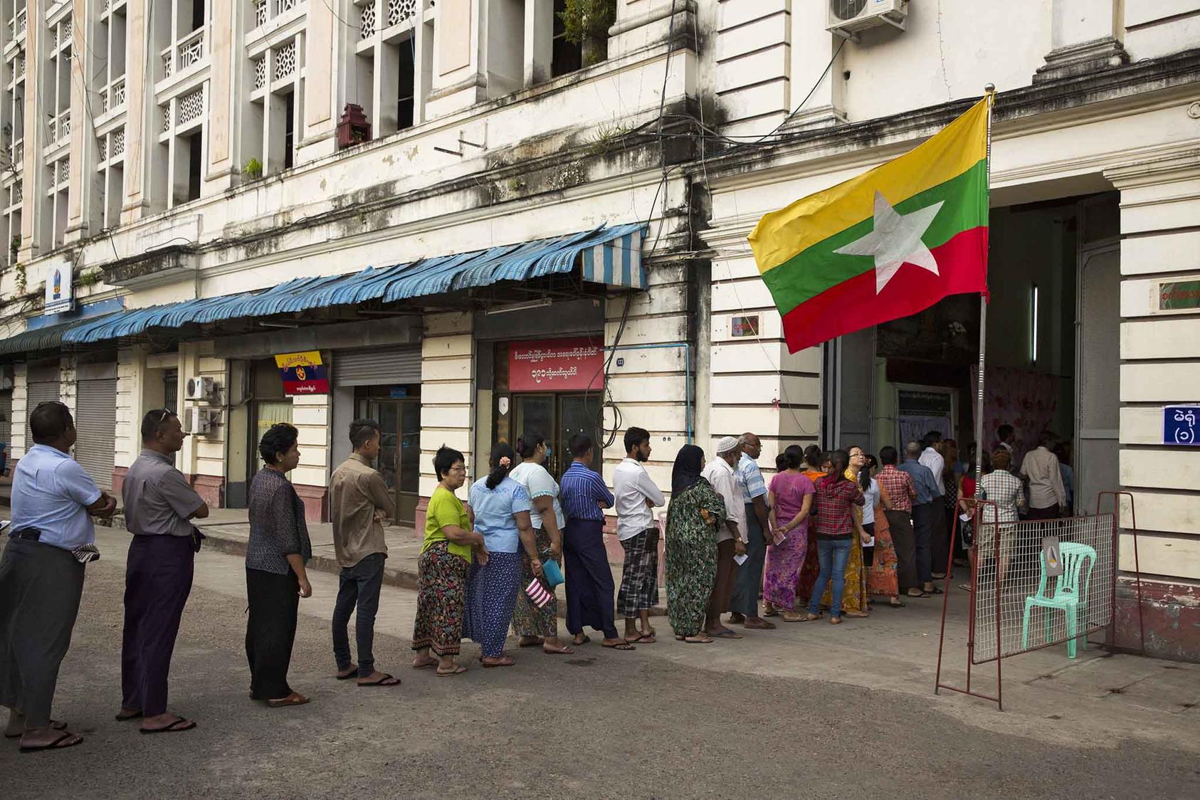 Citizens line up outside a polling station in Yangon to vote in the historic 2015 elections. (Adam Dean/The New York Times)