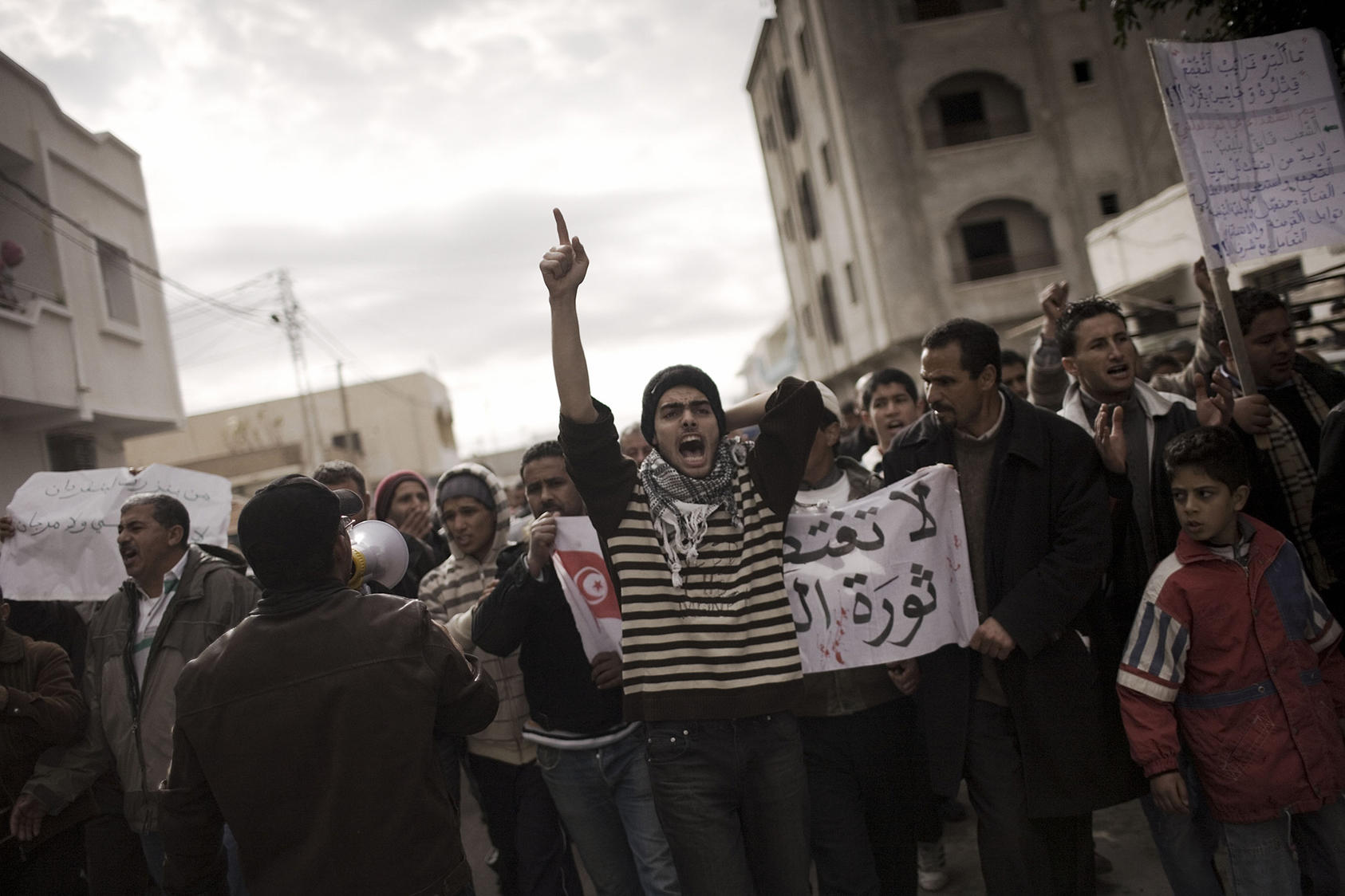 Protesters chant slogans against the political party of ousted President Zine el-Abedine Ben Ali in Sidi Bouzid, Tunisia, on Jan. 21, 2011. (Moises Saman/The New York Times)