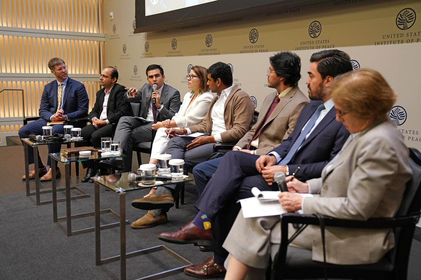 Left to right: USIP's Steve Hege; Colombian lawmakers John Jairo Hoyos, Carlos Ardila, Juanita Goebertus, David Racero, David Pulido, and Gabriel Santos; Woodrow Wilson Center's Cynthia Arnson.