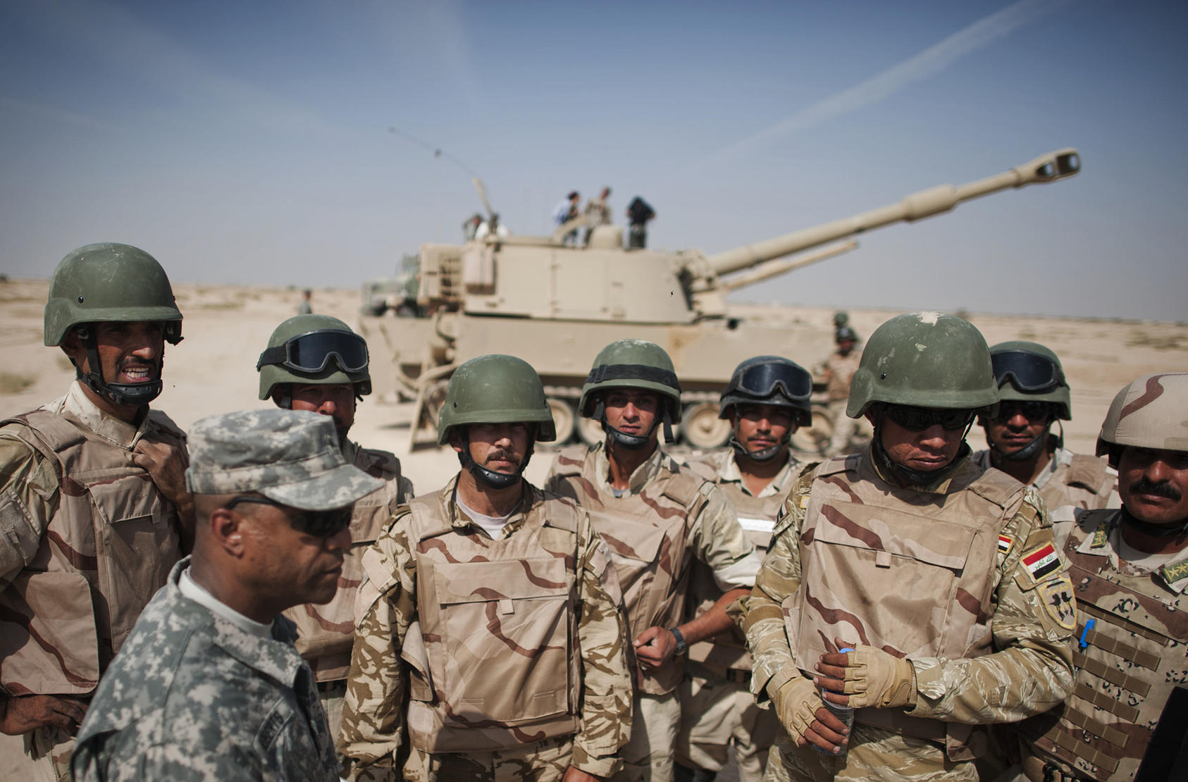 The U.S. military organizes a demonstration at the Iraqi Armor School after the Iraqi soldiers completed a 21-day tank training course, in Besmaya, Iraq, Oct. 18, 2011. (Andrea Bruce/The New York Times)