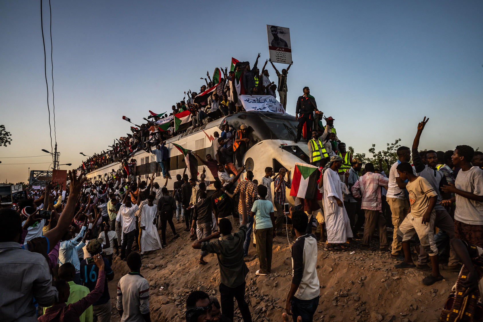 A train carrying demonstrators from al-Atbara arrives in Khartoum, Sudan, April 23, 2019. (Bryan Denton/The New York Times)
