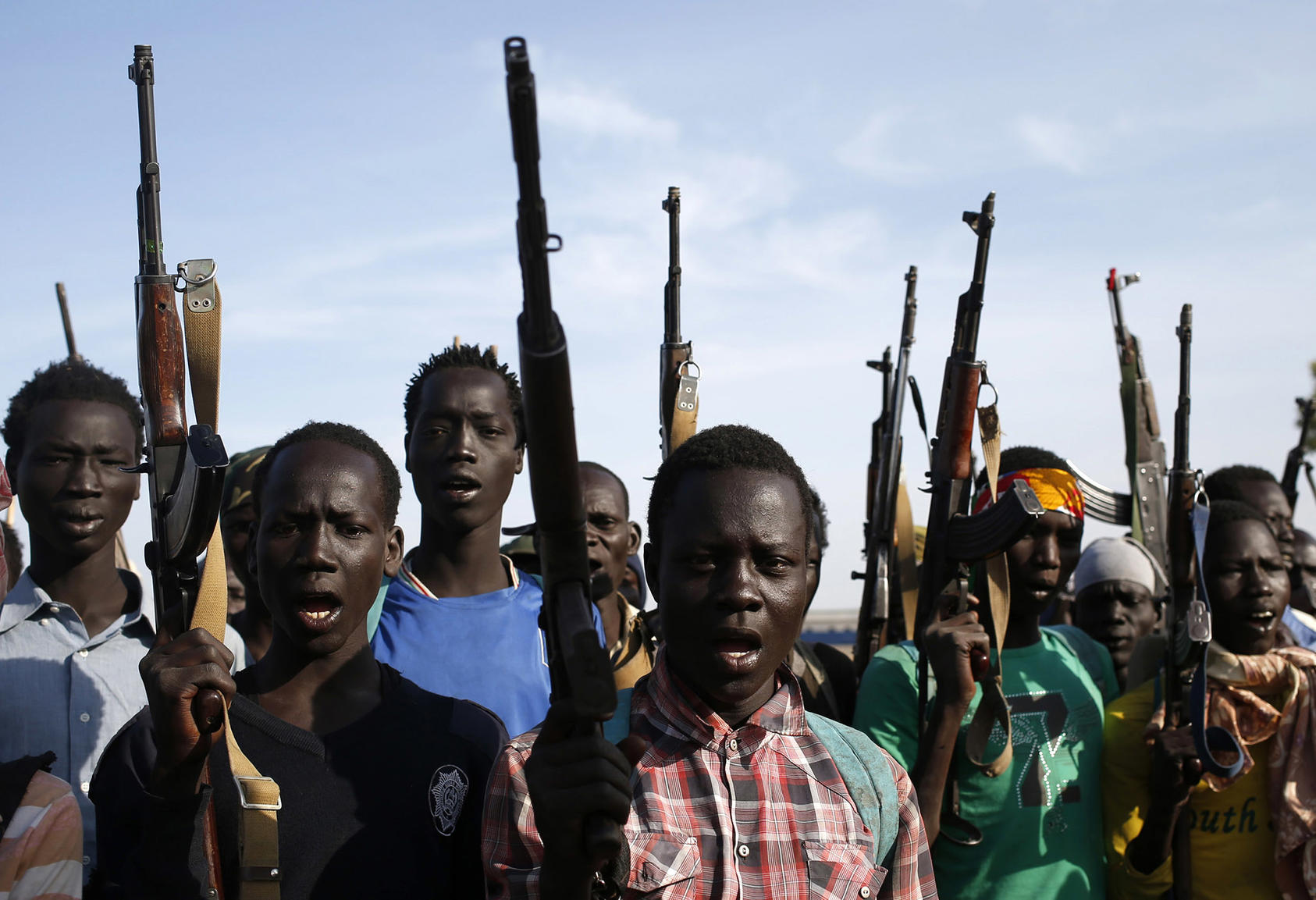 Rebel fighters hold their weapons in Upper Nile State in February 2014. (Goran Tomasevic/Reuters)