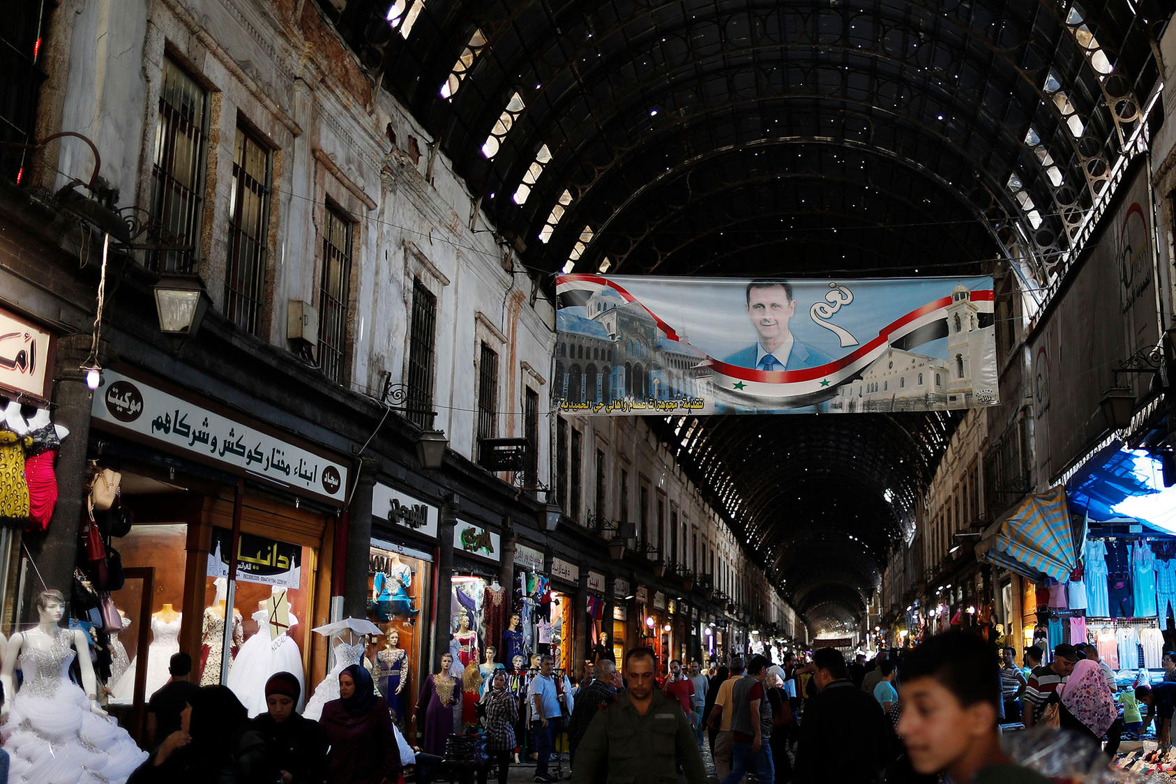 A poster of President Bashar al-Assad with “Yes” in Arabic hangs in the Hamadiyah market in the Old City of Damascus. (Photo by Hassan Ammar/AP/ Shutterstock.)