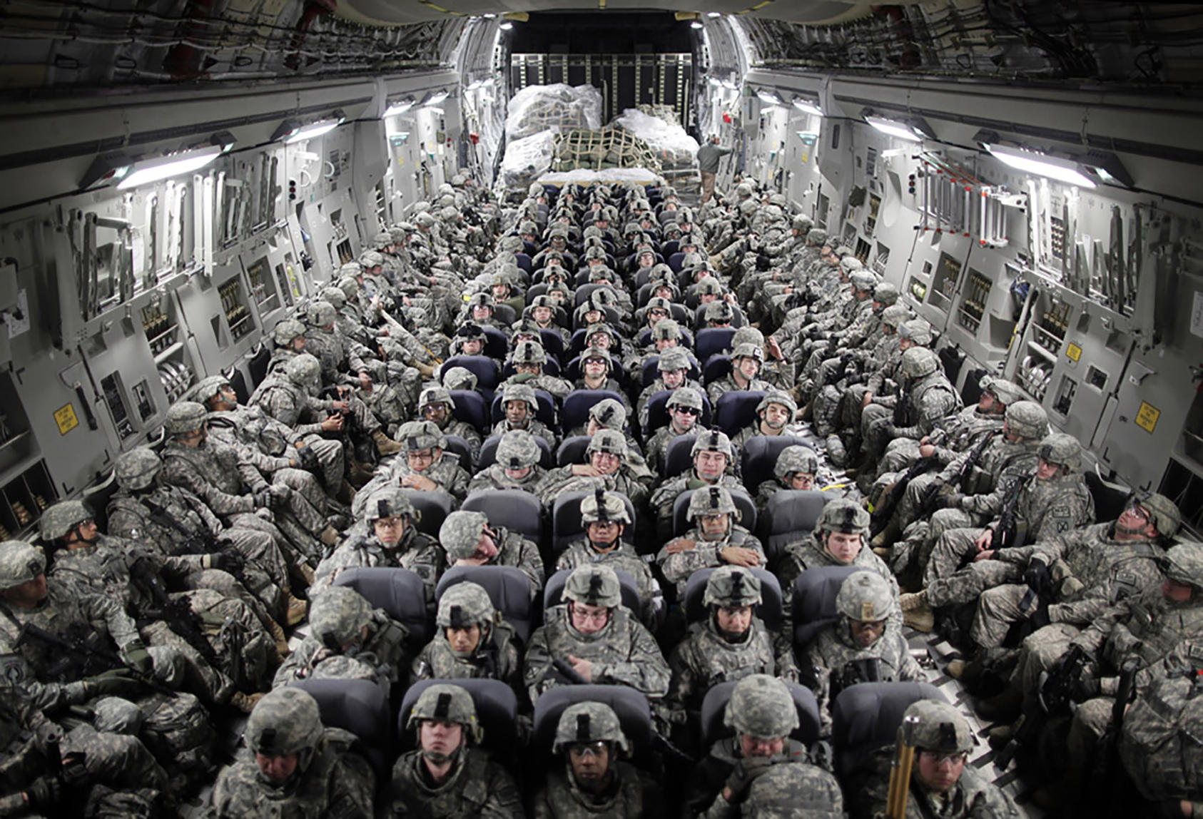American soldiers on a transport plane that is about to land in Mazar-i-Sharif, in northern Afghanistan, April 5, 2010. (Damon Winter/The New York Times)