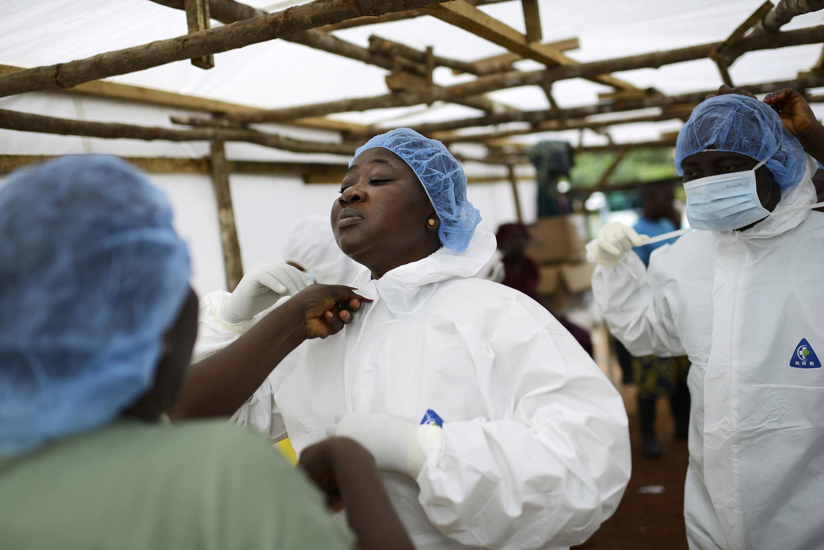 Josephine Finda Sellu, deputy nurse matron at a government hospital, before going into the isolation area for Ebola patients, in Kenema, Sierra Leone, Aug. 20, 2014. (Samuel Aranda/The New York Times)