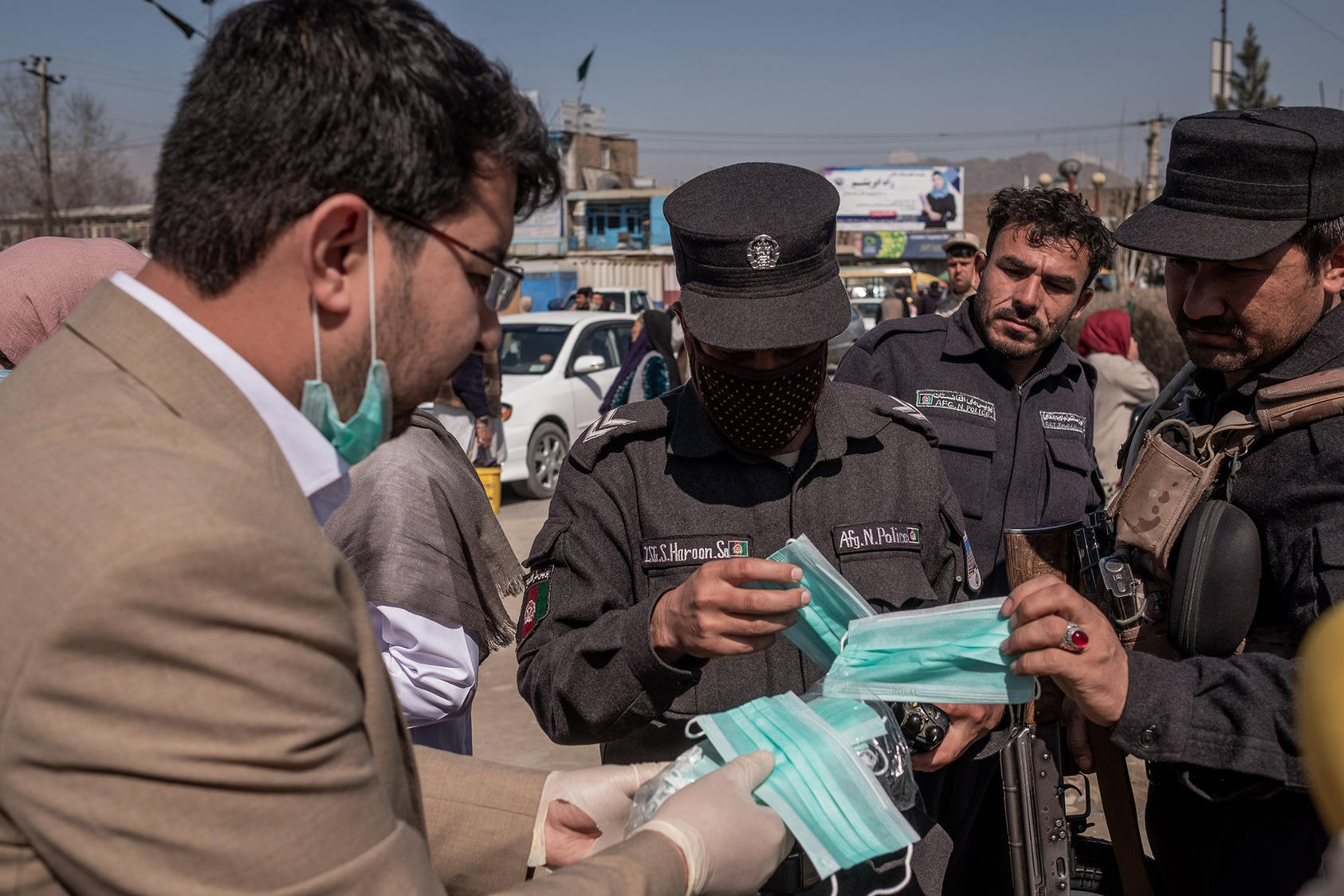 Activists hand out masks, gloves and hand sanitizer in Kabul, Afghanistan, on March 18, 2020. (Jim Huylebroek/The New York Times)