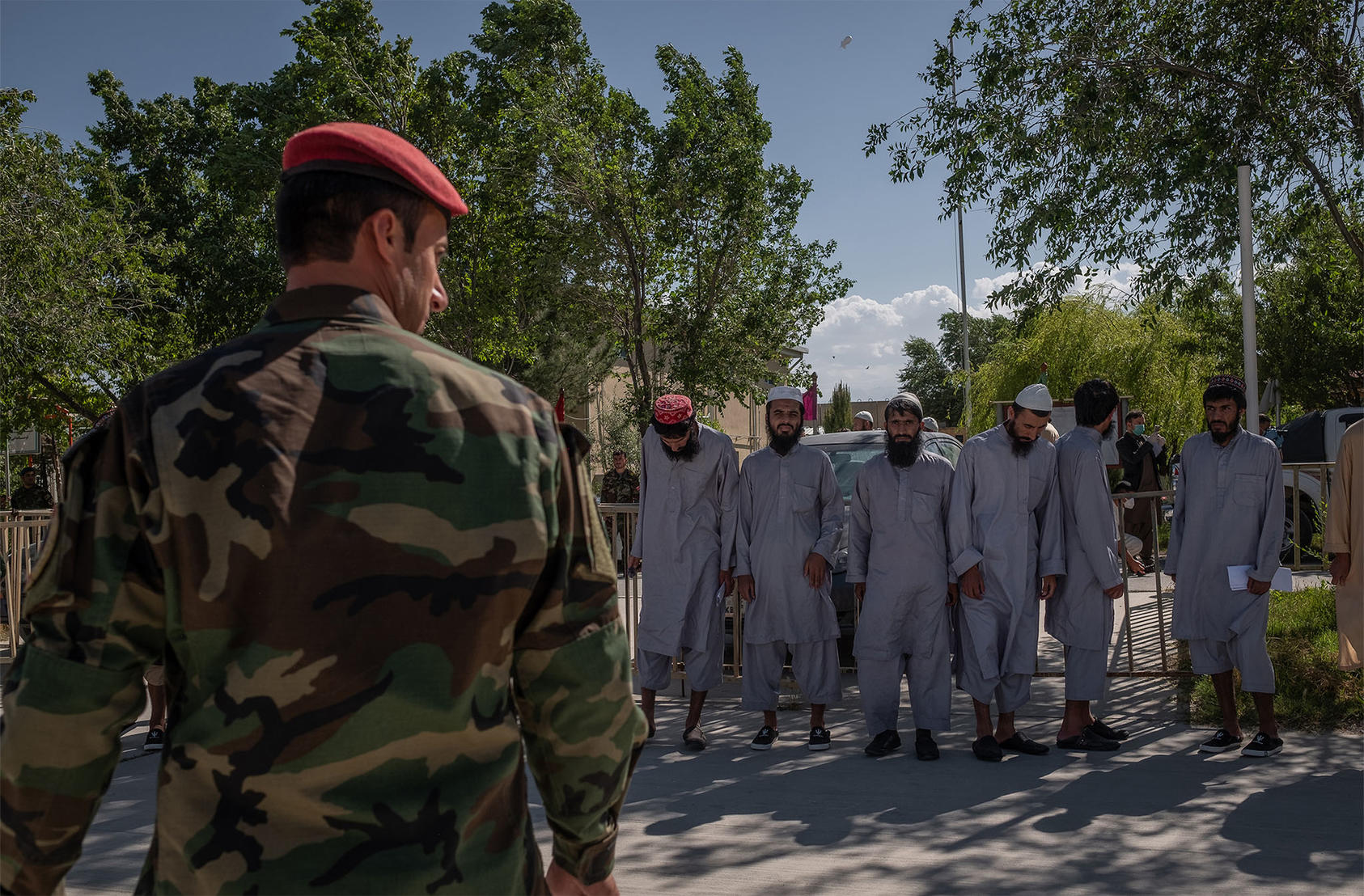 Taliban prisoners are lined up at the Bagram military base before being released in Afghanistan, May 26, 2020. (Jim Huylebroek/The New York Times)