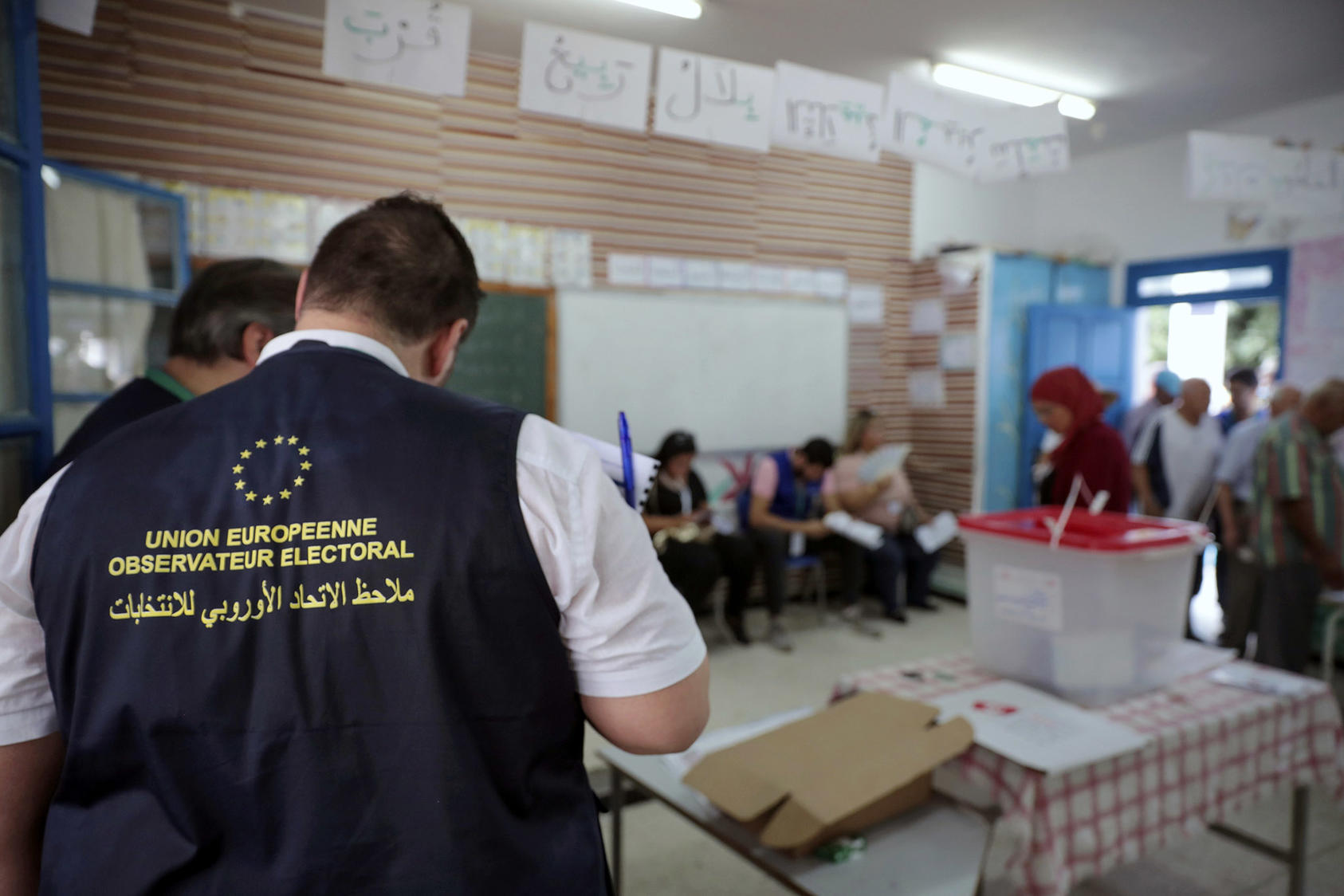 Observers from the European Union monitor the election process inside a polling station outside Tunis during the first round of the presidential election on September 15, 2019. (Mosa’ab Elshamy/AP)
