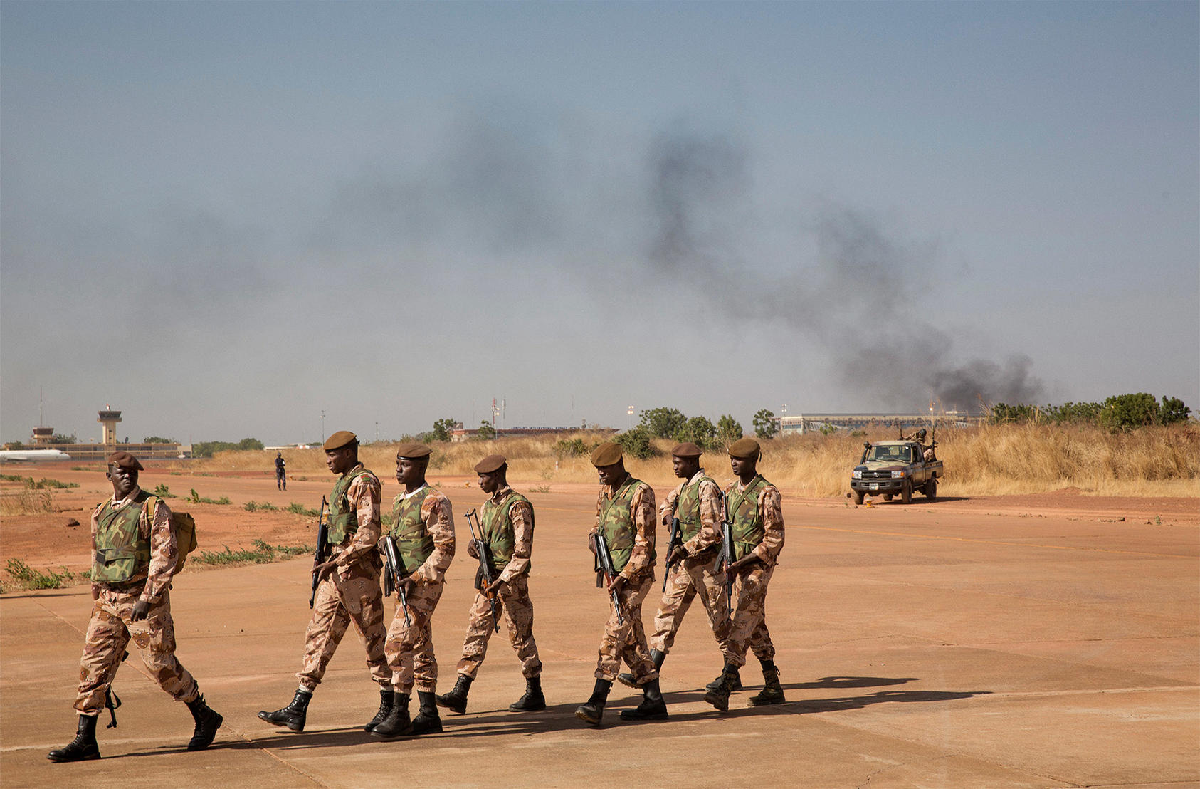 Malian soldiers patrol an airbase in Bamako, Mali, Jan. 16, 2013. (Marco Gualazzini/The New York Times)