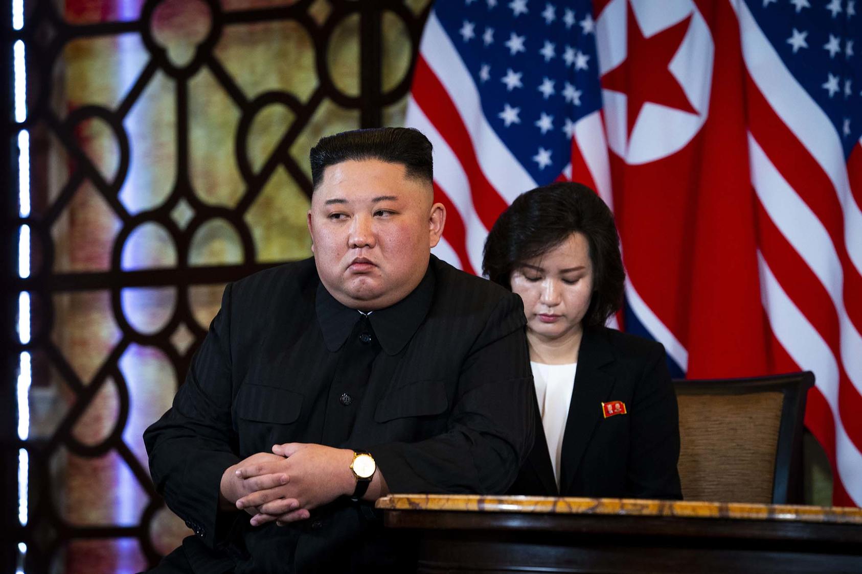 North Korean leader Kim Jong-un sits opposite President Donald Trump at their 2019 meeting in Hanoi. As the Biden administration prepared to take office, Kim vowed to increase North Korea’s nuclear weapons capabilities. (Doug Mills/The New York Times)