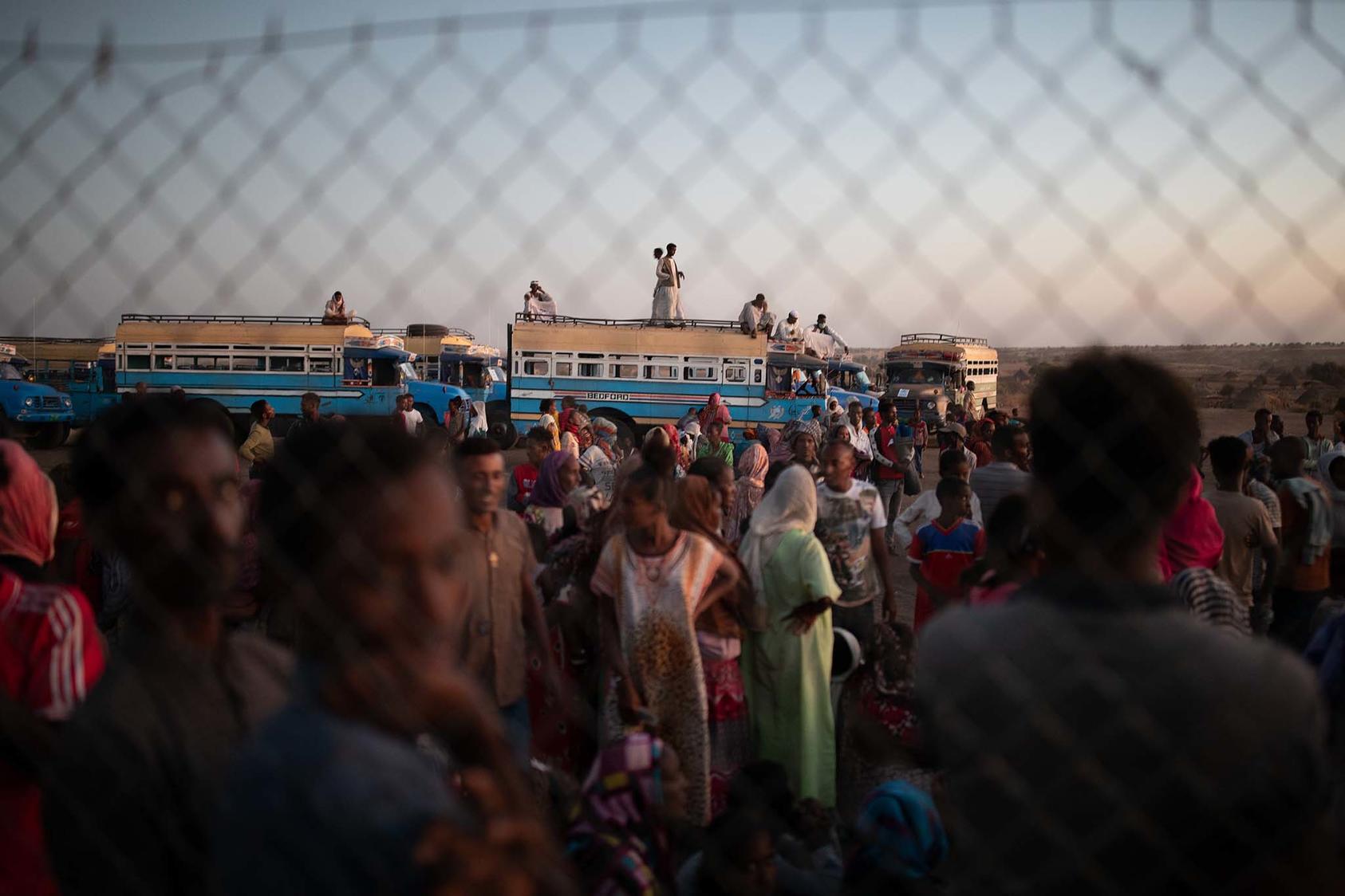 Ethiopian refugees wait for relief supplies at a United Nations compound in Hamdayet, Sudan, on Saturday, Dec. 5, 2020. (Tyler Hicks/The New York Times)