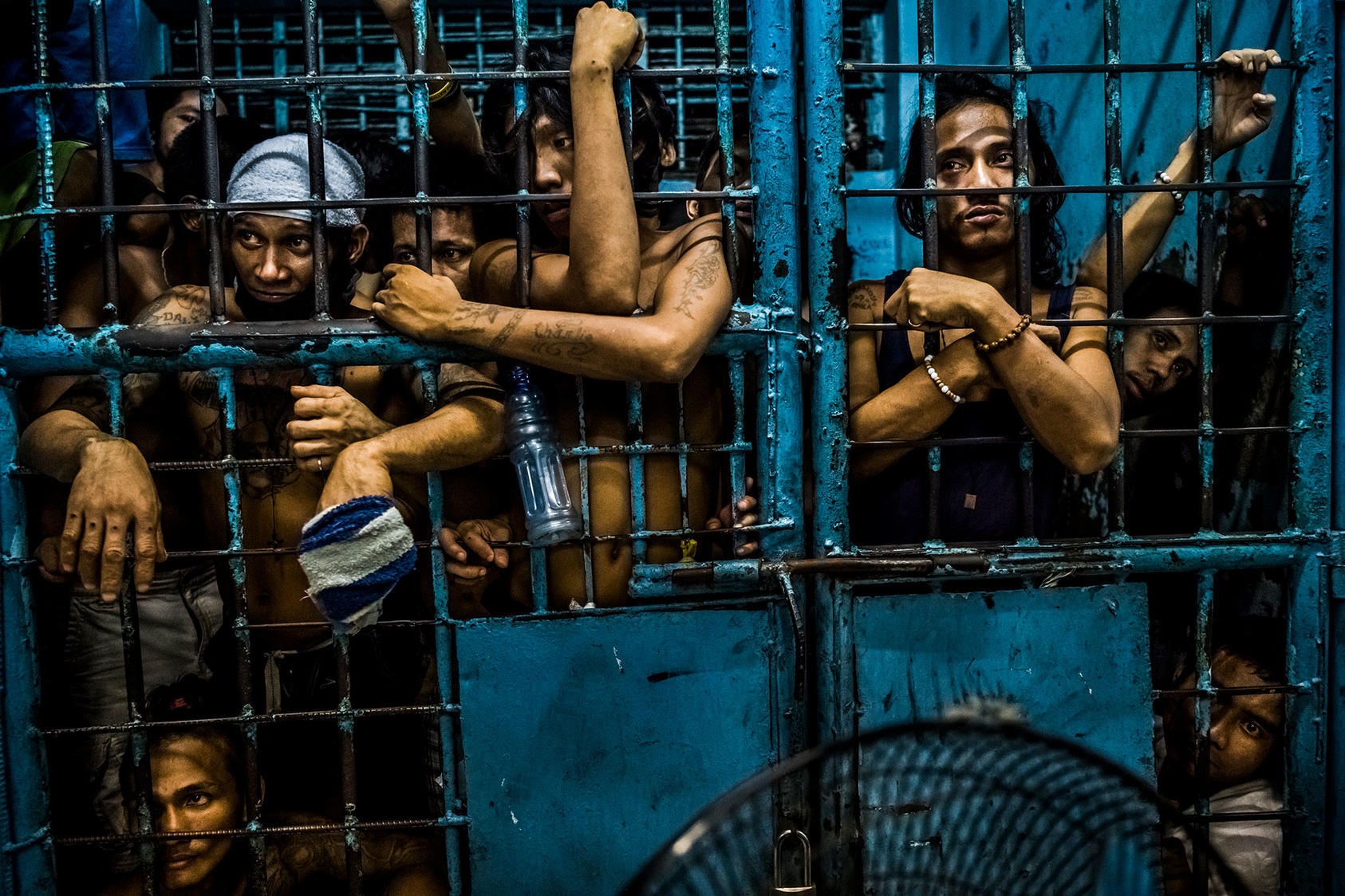 Prisoners await processing in 2016 at a police station in the Philippines, one of many countries where systemic violence by security forces undermines security, according to analysts and human rights monitors. (Daniel Berehulak/The New York Times)