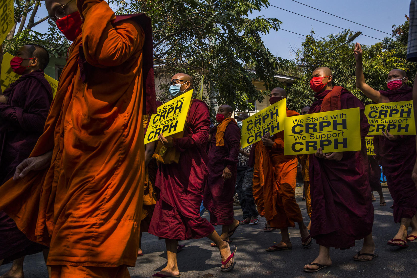 Buddhist monks protest the army coup of Myanmar in Mandalay, Feb. 27, 2021. However, monks have been less involved than they were in previous movements, such as the monk-led 2007 Saffron Revolution. (The New York Times)
