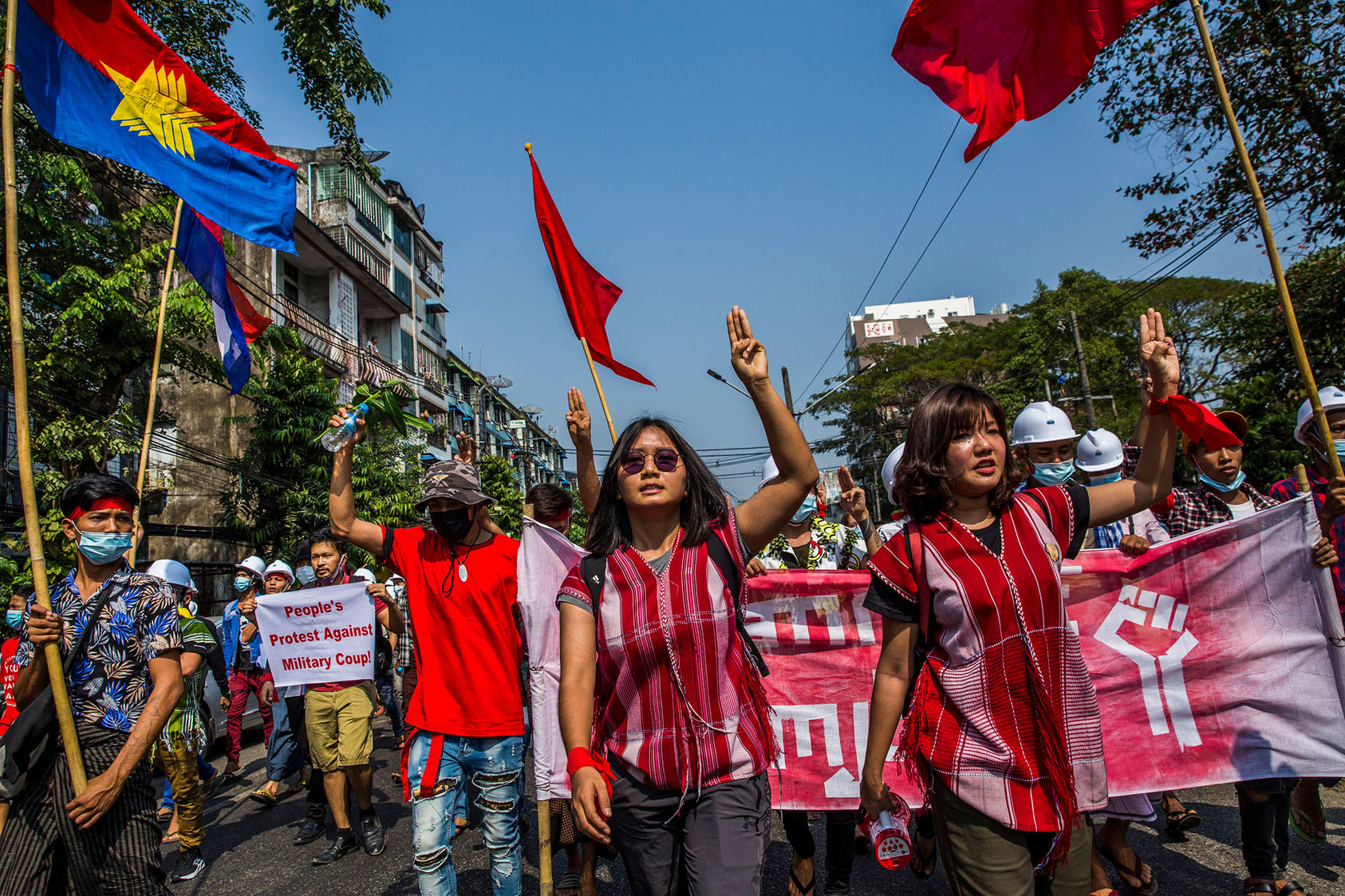 Esther Ze Naw and Ma Ei Thinzar Maung lead a rally to protest the recent military coup, in Yangon, Myanmar, Feb. 6, 2021. Despite the danger, women have been at the forefront of the protest movement, rebuking the generals who ousted a female civilian leader. (The New York Times) 