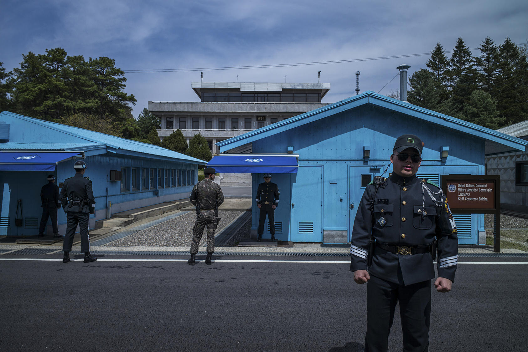Soldiers stand guard outside of meeting rooms that straddle the border between North and South Korea in Panmunjom along the Demilitarized Zone, April 19, 2017. (Lam Yik Fei/The New York Times) 