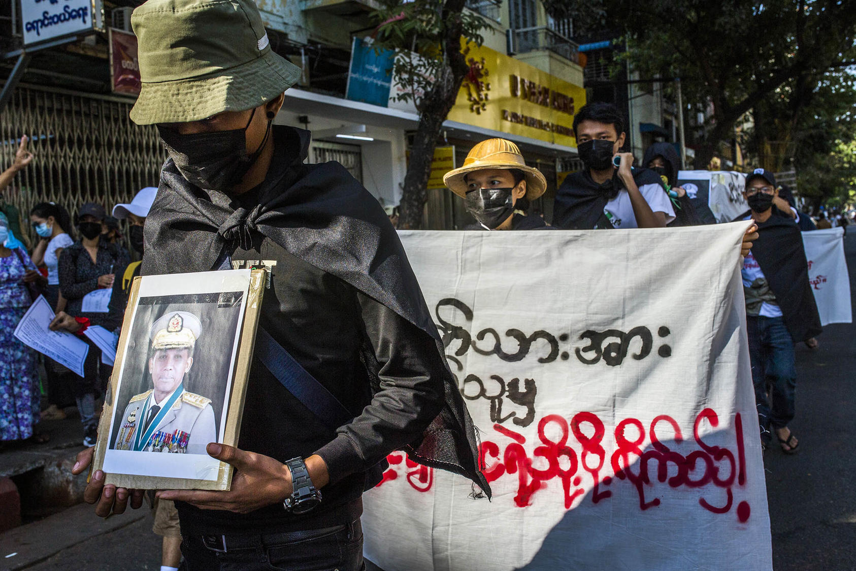 Protesters in Yangon, Myanmar, stage a faux "funeral" for coup leader Gen. Min Aung Hlaing, on Feb. 10, 2021, days after the coup. (The New York Times)