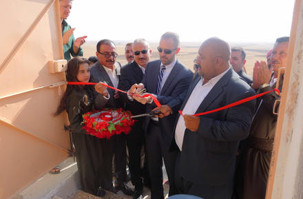 The author, Knox Thames, cuts the ribbon of the reconstructed Yazidi temple in Khoshaba, Iraq, September 2017.