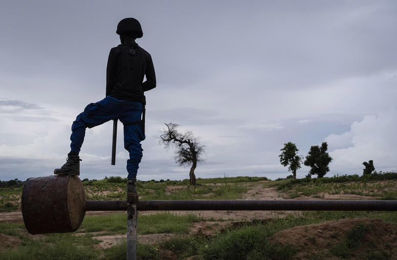 A civilian vigilante serves as a lookout along the last line of defense for the southeastern flank of Maiduguri, the biggest city in northeastern Nigeria, Aug. 22, 2019. (Laura Boushnak/The New York Times)