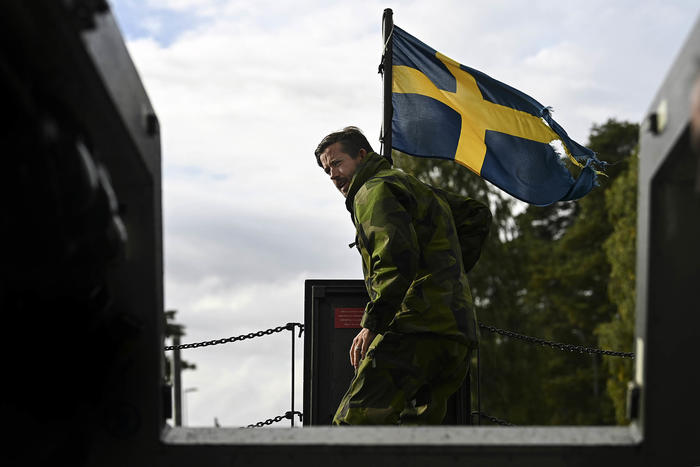 A Swedish Marine on board a combat boat during joint military exercises with American Marines at Berga Naval Base in Sweden on Sept. 13, 2022. (Kenny Holston/The New York Times)