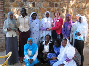 Workshop participants pose for a picture with USIP Executive Vice President Patricia Thomson