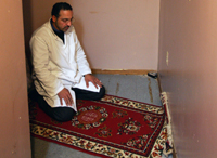 A Muslim man prays.
