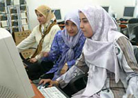 Iraqi women practice their computer skills in Iraq.