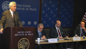 USIP President Dr. Richard Solomon makes opening remarks at the event.