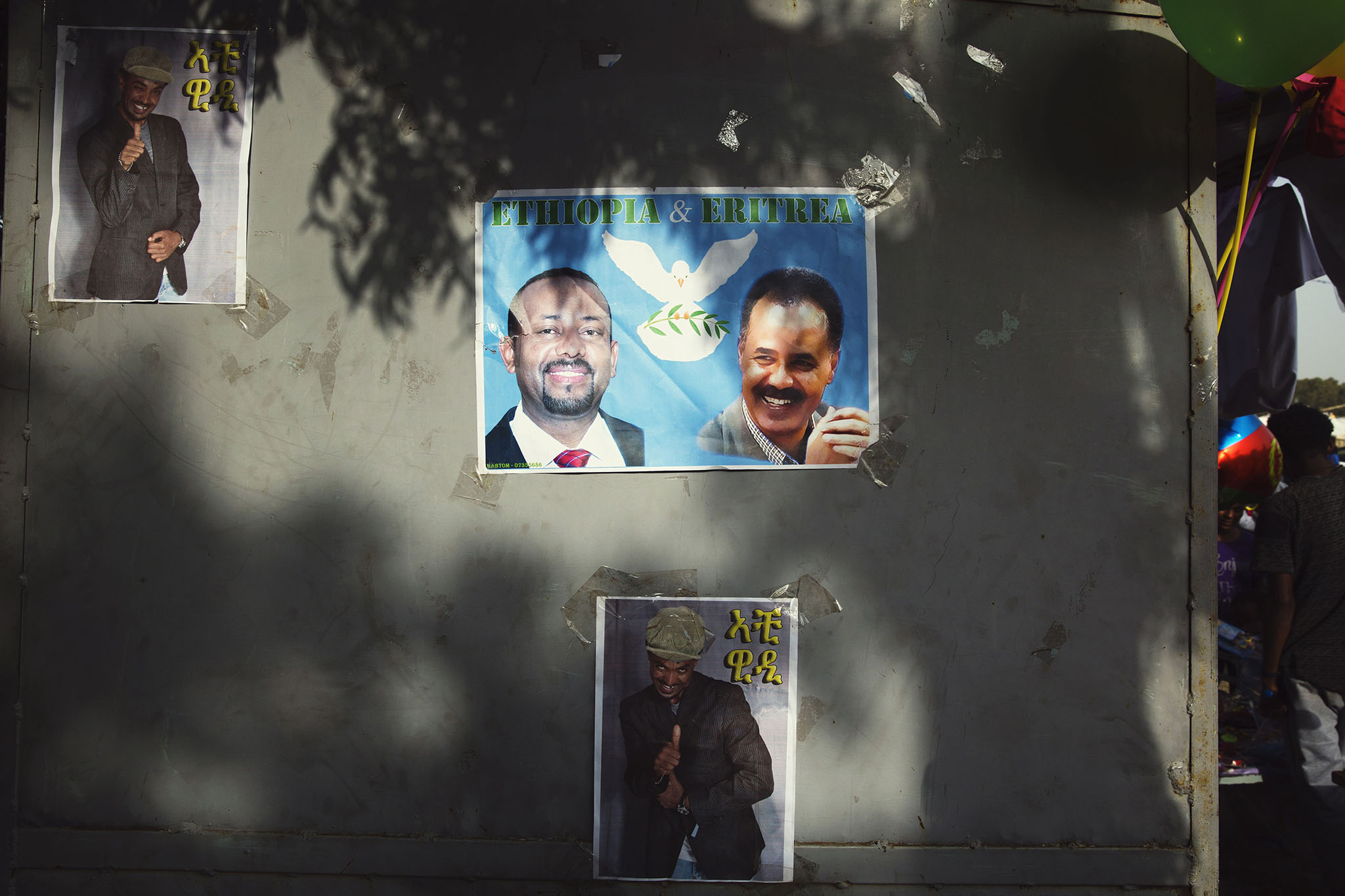 A poster of Prime Minister Abiy Ahmed of Ethiopia, left, and President Isaias Afwerki of Eritrea is displayed during a festival in Asmara, Eritrea, Sept. 7, 2018. (Malin Fezehai/The New York Times)