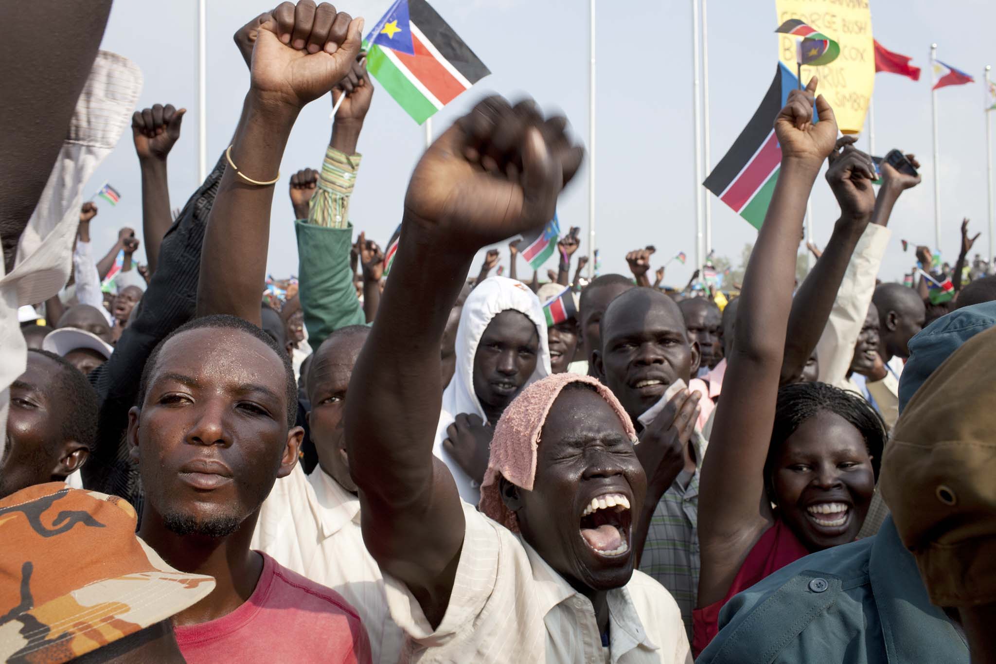 South Sudanese cheer and wave flags as they celebrate their nation's independence in Juba, South Sudan, July 9, 2011. (Tyler Hicks/The New York Times)