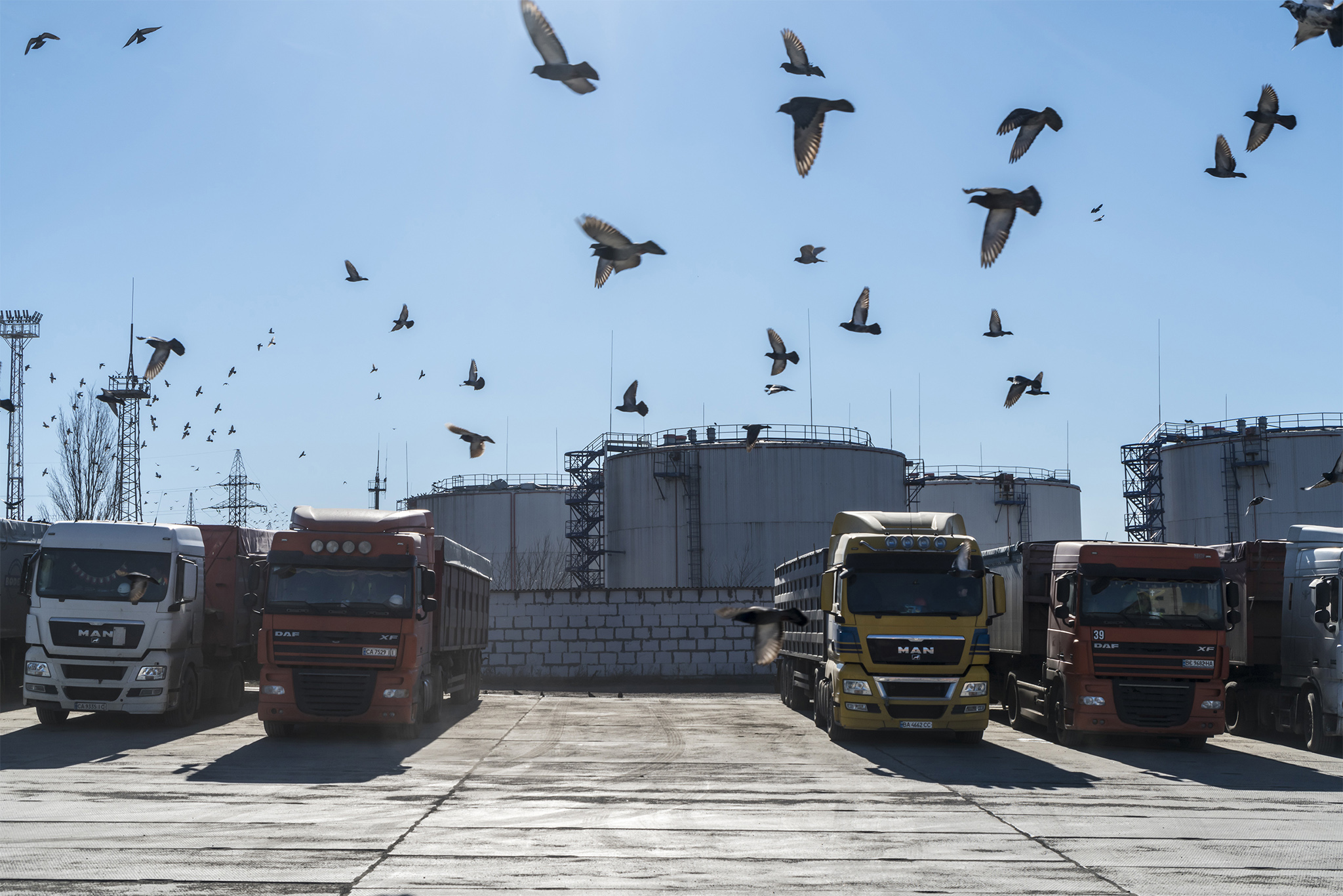 Trucks loaded with wheat at the Port of Mykolaiv in Ukraine, Feb. 14, 2022. The U.N. warned on April 16 that closures of ports on the Black Sea could trigger a global food catastrophe that yields starvation, mass migration and political instability. (Brendan Hoffman/The New York Times)